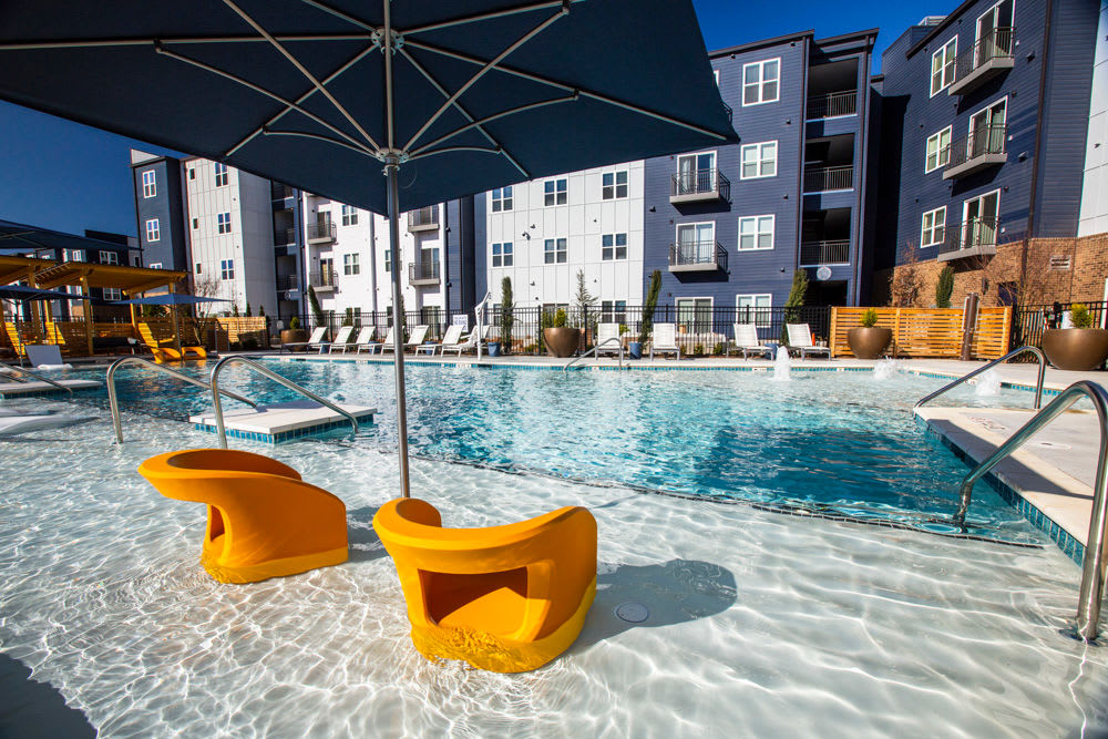 Swimming pool with -in-water chairs at Beacon Station in Augusta, Georgia