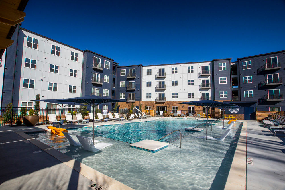 Swimming pool and surrounding apartment units at Beacon Station in Augusta, Georgia