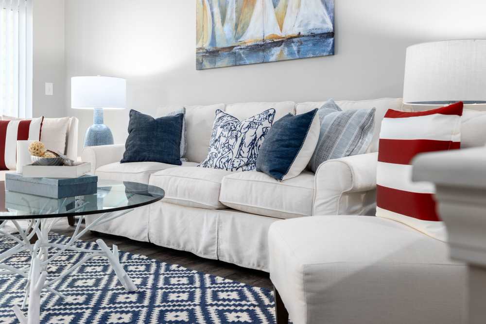 Cozy couch in a furnished living room at The Grove at Oakbrook in Summerville, South Carolina