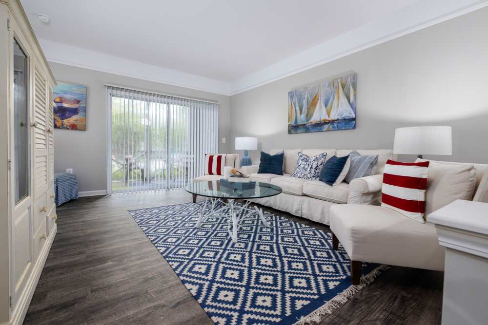 Living room with sliding glass door in a model home at The Grove at Oakbrook in Summerville, South Carolina