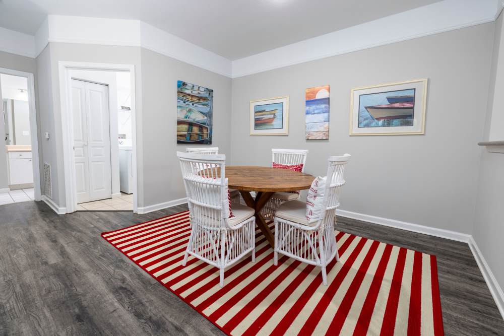 Dining table with hardwood flooring in a model home at The Grove at Oakbrook in Summerville, South Carolina