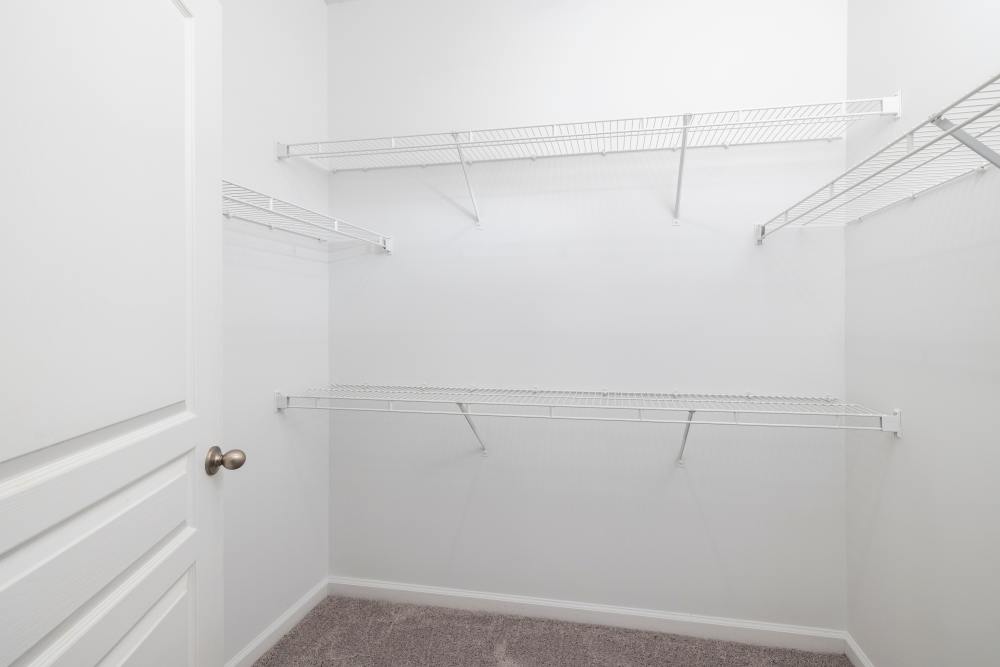 Walk-in closet in a model home at The Grove at Oakbrook in Summerville, South Carolina