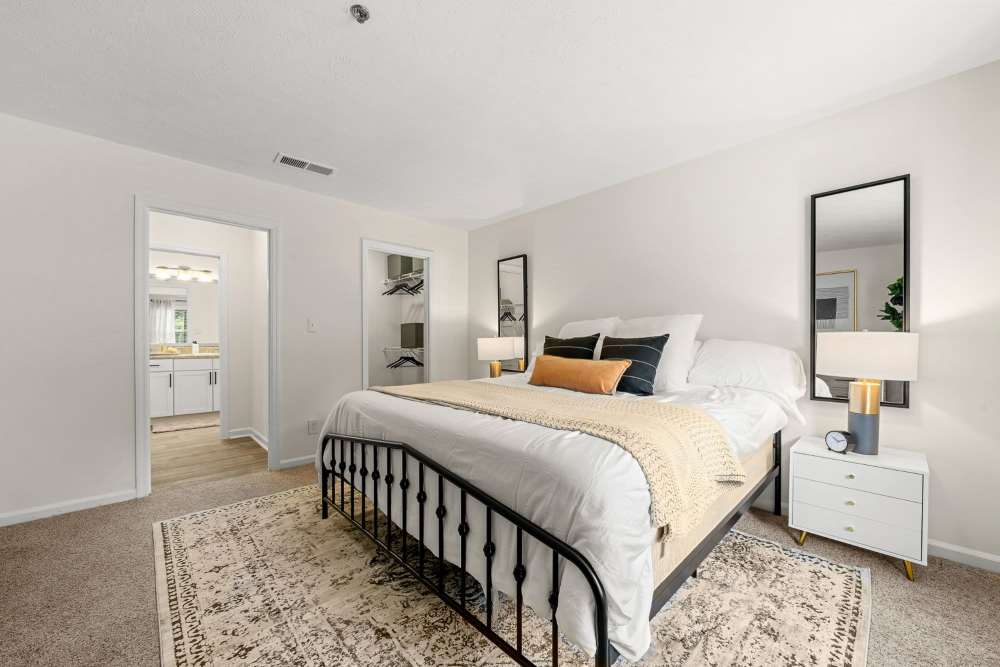 Modern bedroom at The Seasons Apartments in Laurel, Maryland