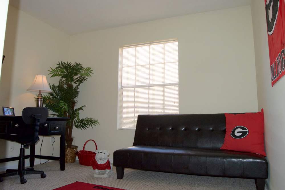 Business center with a couch at Cambridge Apartments in Athens, Georgia