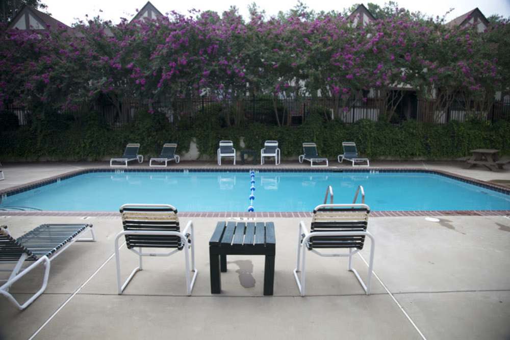 Swimming pool with lounge chairs at Cambridge Apartments in Athens, Georgia