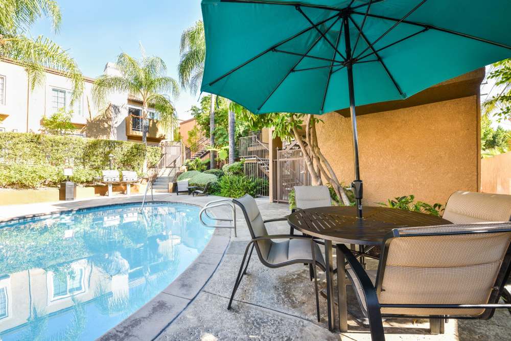Tables and chairs by the pool at Waterstone Media Center in Burbank, California
