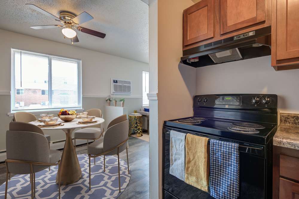 Kitchen with black appliance at Dixon Manor in Rochester, New York