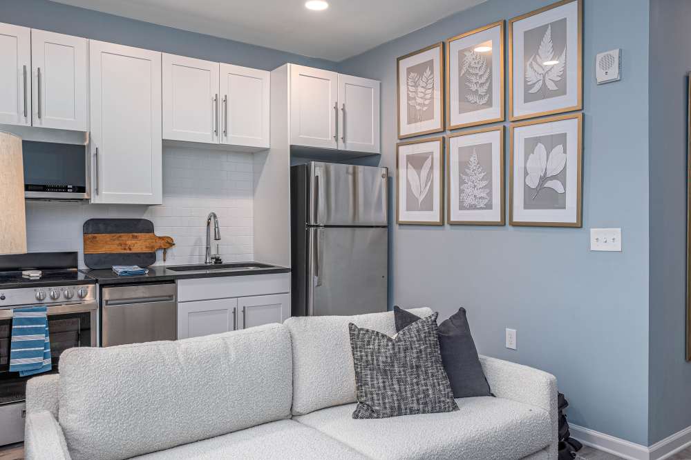 Kitchen and living room in a furnished model home at The Addie in Savannah, Georgia