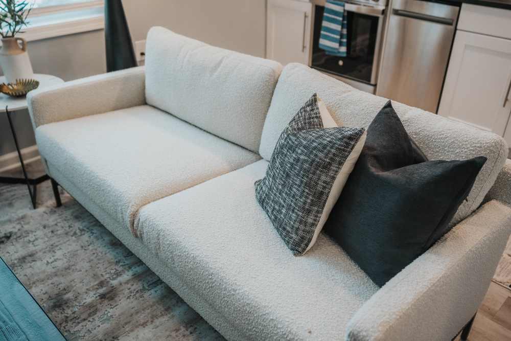 Comfortable couch in the living room of a model home at The Addie in Savannah, Georgia