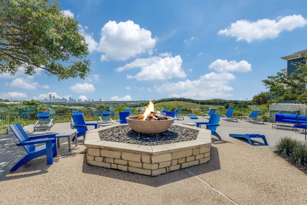 Chairs around a firepit at Cliffs at Barton Creek in Austin, Texas