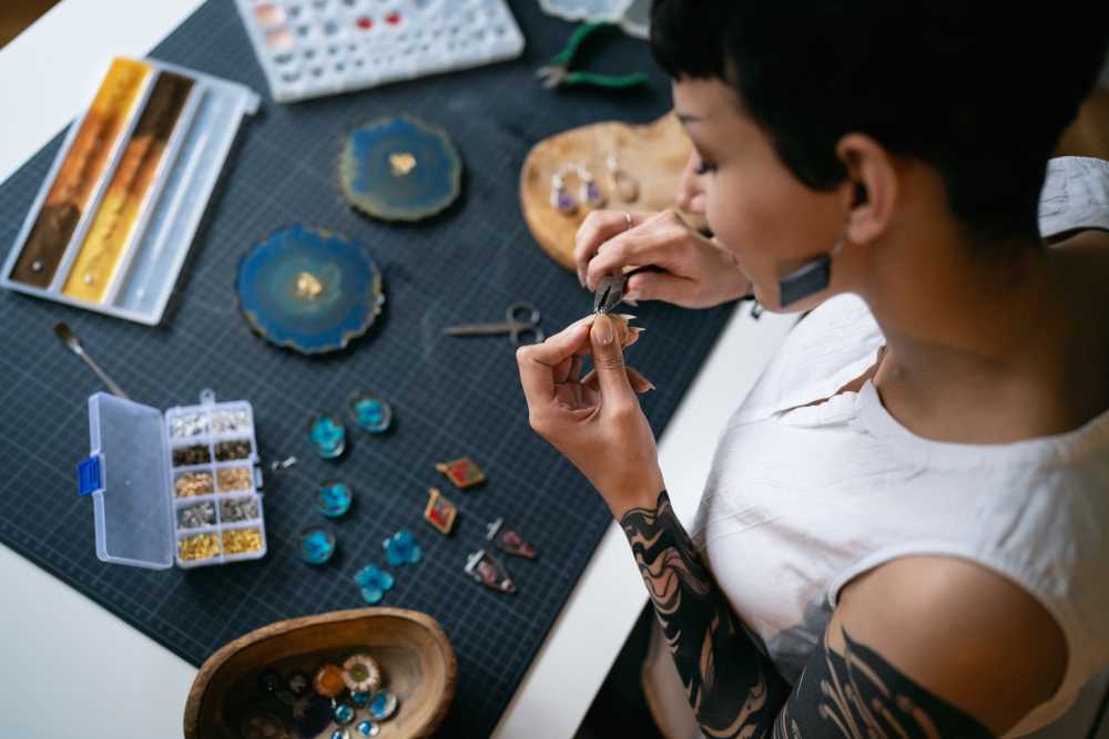 Tenant making jewelry in her office at Workhouse at Union Terminal in Jacksonville, Florida