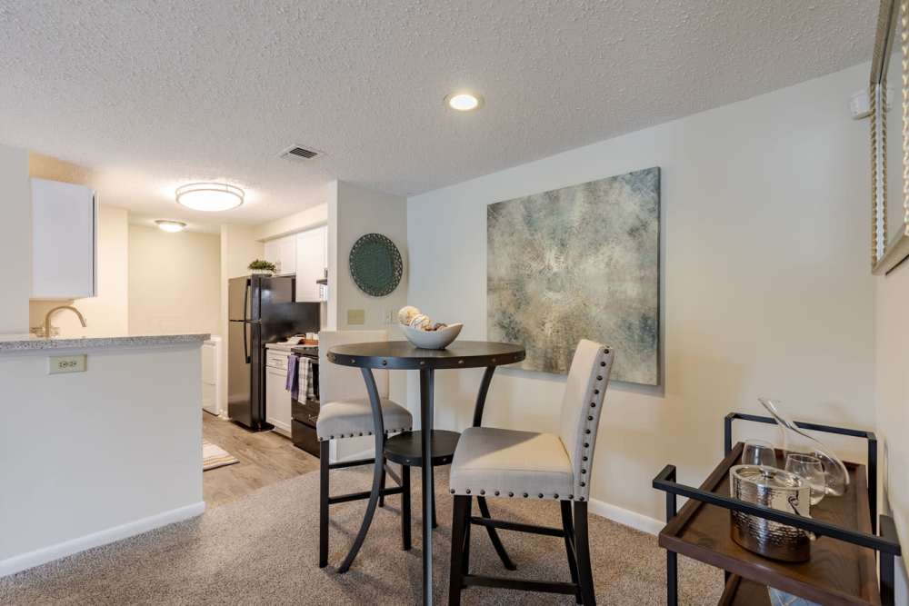 A room with a table and chairs at Kingscrest Apartments in Frederick, Maryland