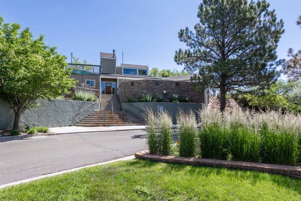 Outdoor Apartment View Across The Street at The Knolls at Sweetgrass Apartment Homes in Colorado Springs, Colorado.