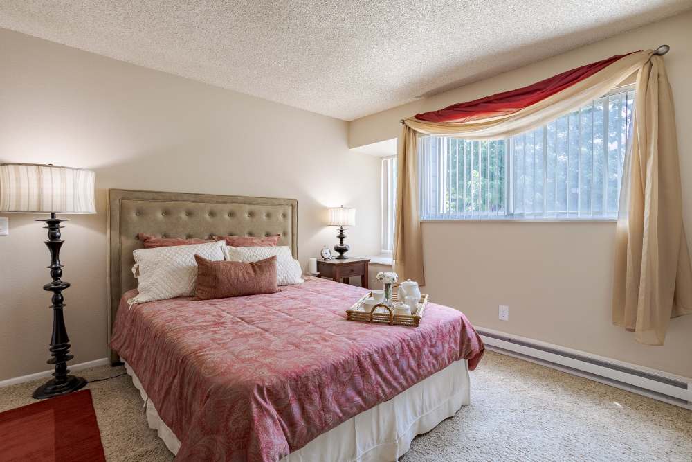 A Comfortable Bedroom with Tea Set at The Knolls at Sweetgrass Apartment Homes in Colorado Springs, Colorado.