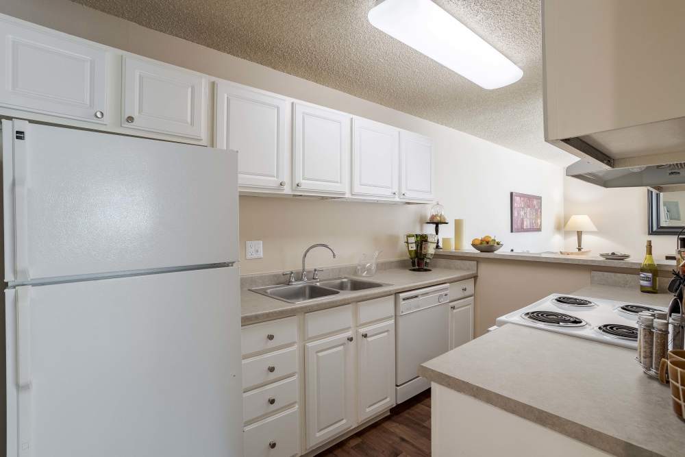 Kitchen Area with Complete Appliances at The Knolls at Sweetgrass Apartment Homes in Colorado Springs, Colorado.