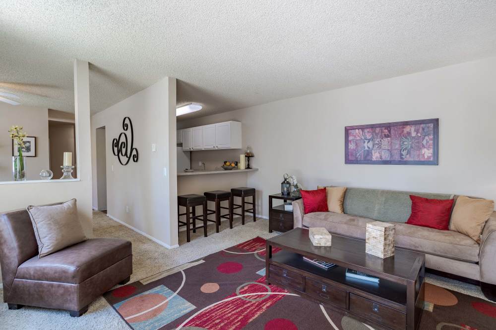 A Well-decorated Living Room at The Knolls at Sweetgrass Apartment Homes in Colorado Springs, Colorado.