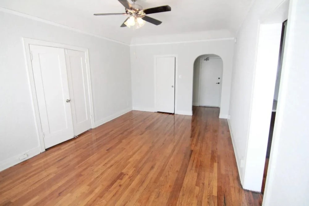 An empty room with attached modern ceiling fan at Westmoreland Apartments in Los Angeles, California