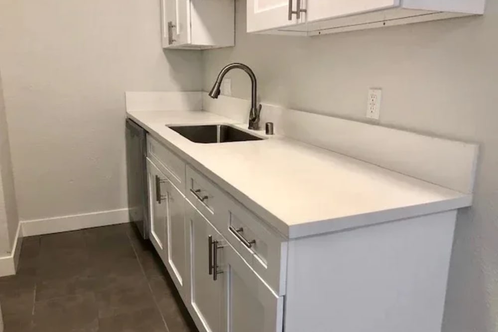 Kitchen with single sink and white marble countertop at Westmoreland Apartments in Los Angeles, California
