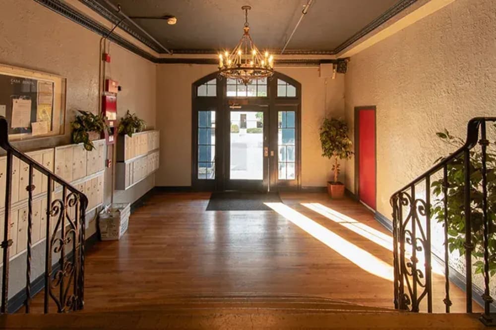 Lavish living room with beautiful railing at Westmoreland Apartments in Los Angeles, California