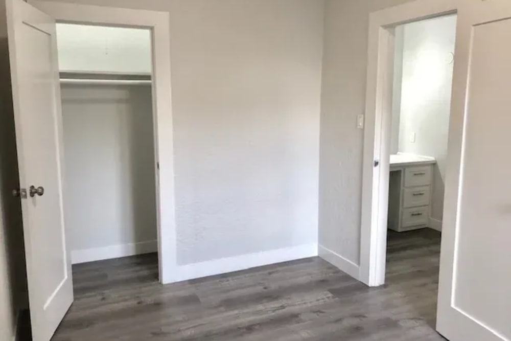 An empty room with attached closet at Westmoreland Apartments in Los Angeles, California