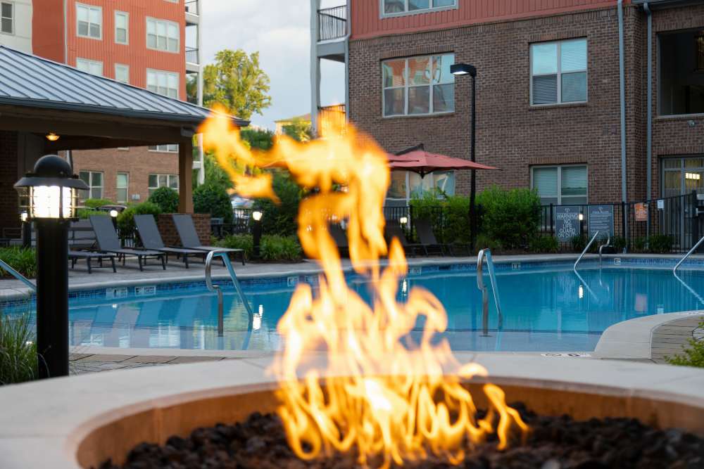 Outdoor firepit by pool at The District in Asheville, North Carolina