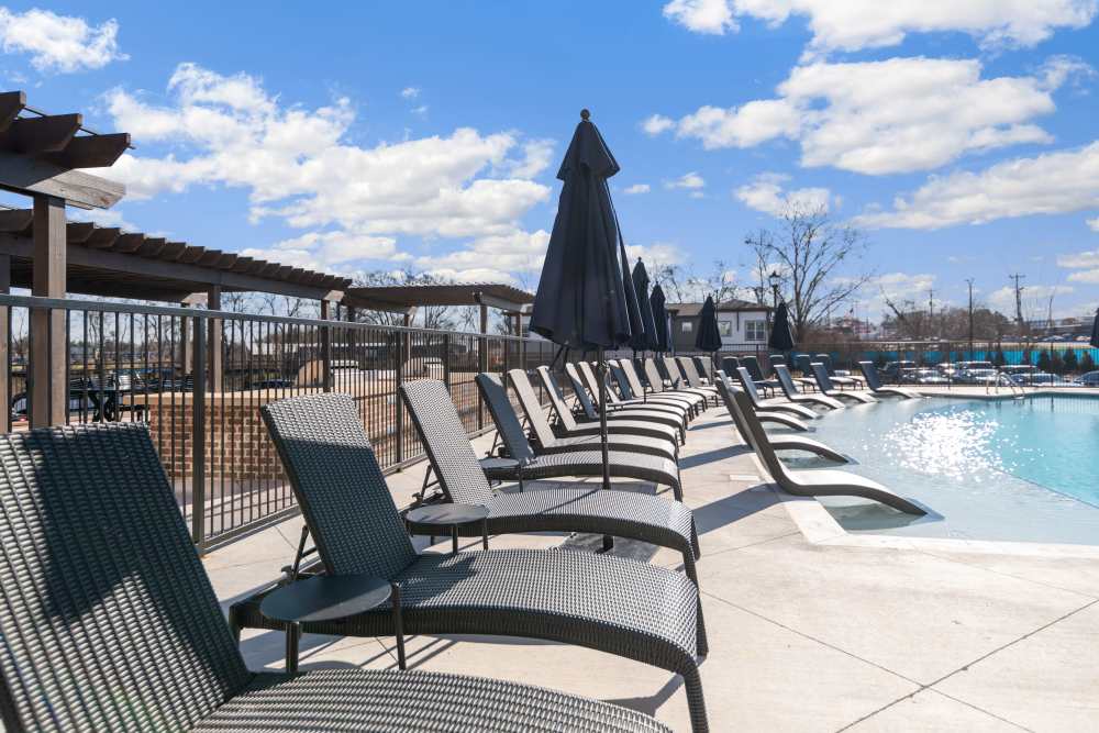 Lounge chairs by the swimming pool at 101 Depot in Smyrna, Tennessee