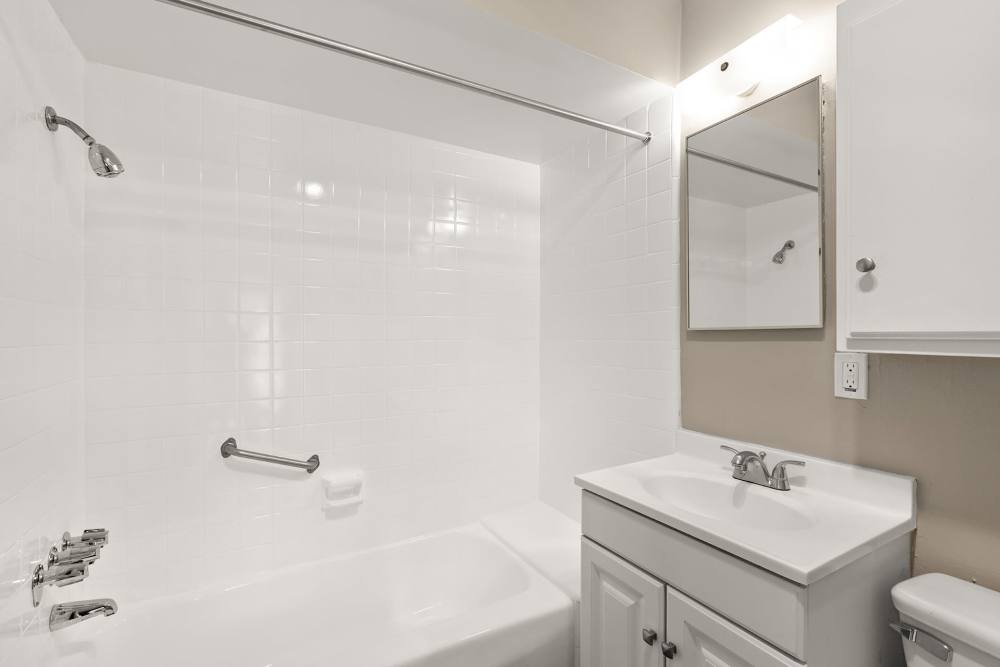 Bright bathroom with shower and tub at Reseda Village Green in Reseda, California