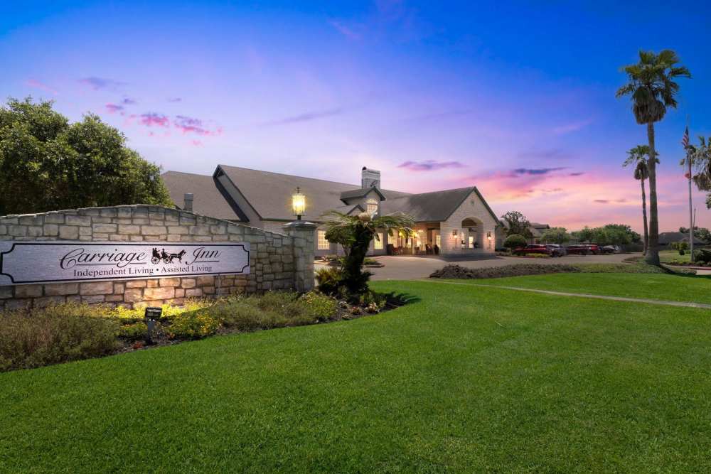 Night View of entrance  to Carriage Inn Lake Jackson in Lake Jackson, Texas
