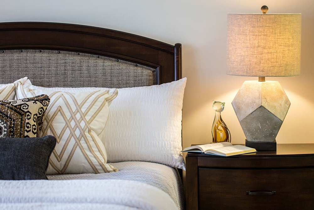 Bed with lots of throw pillows at Cannon Mills & Westover in Dover, Delaware