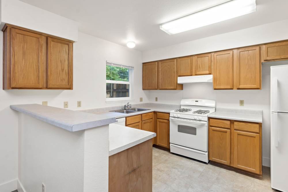 Kitchen view with bar looking into dining room 