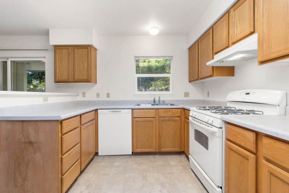 Kitchen view with over kitchen sink, dishwasher and oven