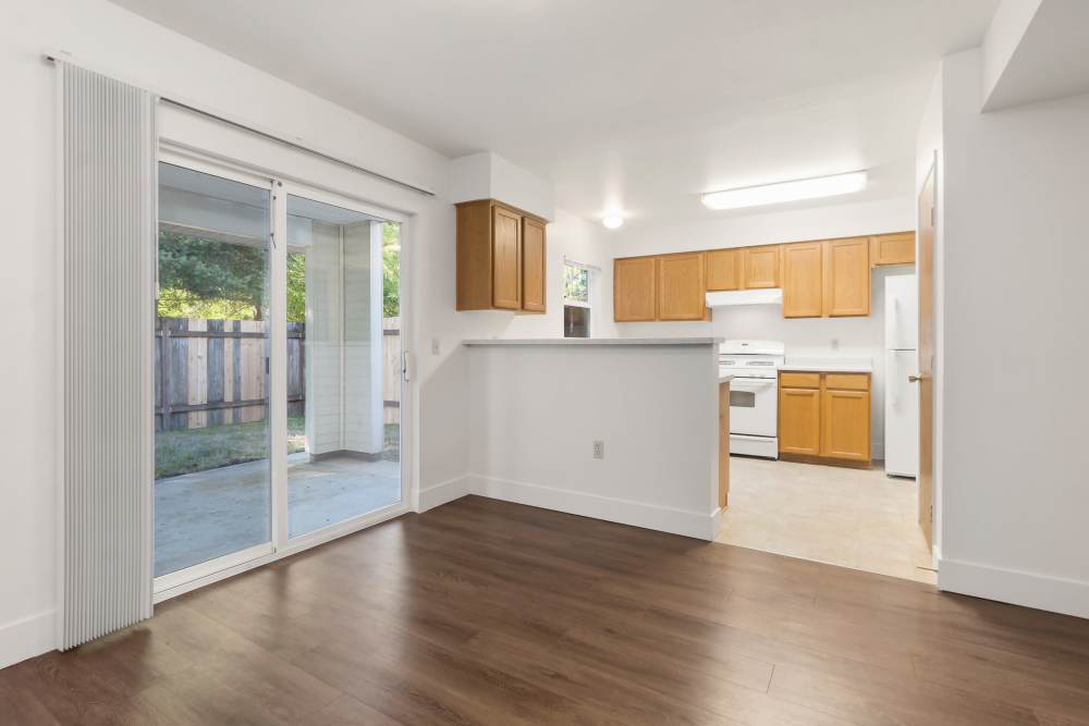 Open concept dining room with access to patio