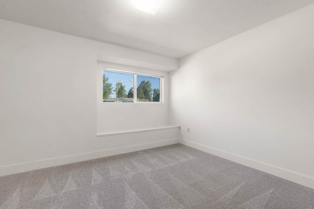Large bedroom with carpet and nook