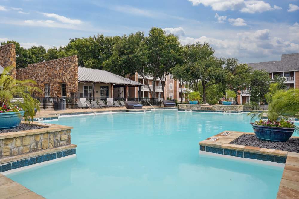 High-end swimming pool at Flatiron District at Austin Ranch in The Colony, Texas