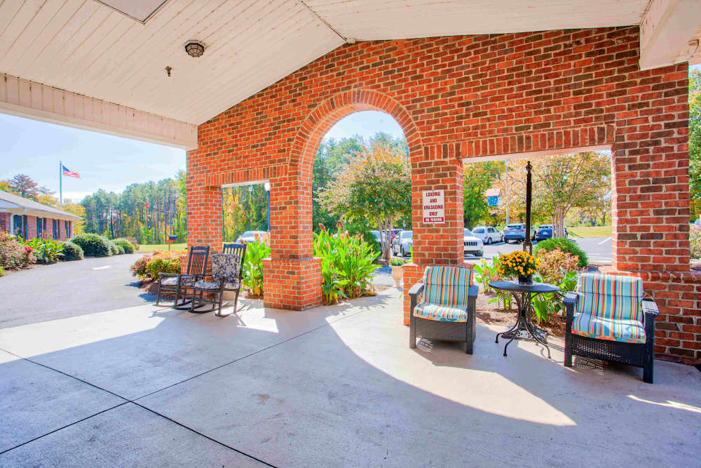 Exterior seating with covering Clemmons Village Assisted Living and Memory Care in Clemmons, North Carolina