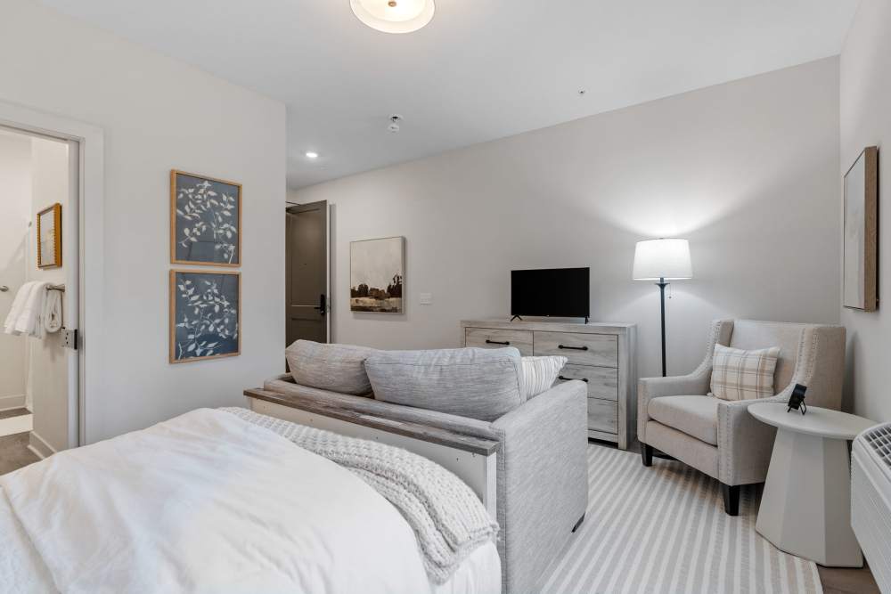 Model unit bedroom with TV at Amira Choice Arvada in Arvada, Colorado
