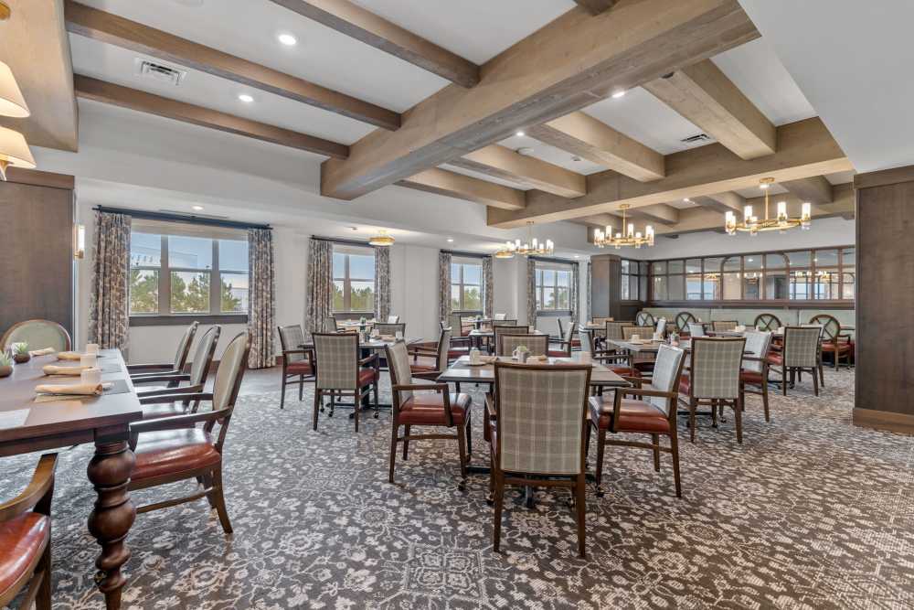 Dining room with multiple tables at Amira Choice Arvada in Arvada, Colorado