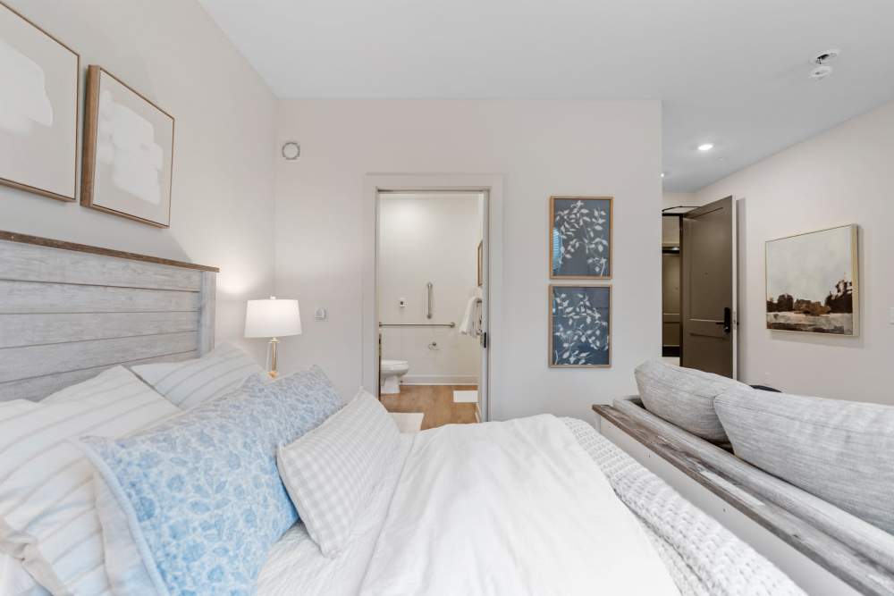 Model unit bedroom and bathroom at Amira Choice Arvada in Arvada, Colorado