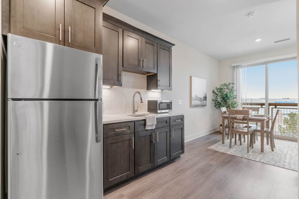Kitchen with dining table and chairs at Amira Choice Arvada in Arvada, Colorado
