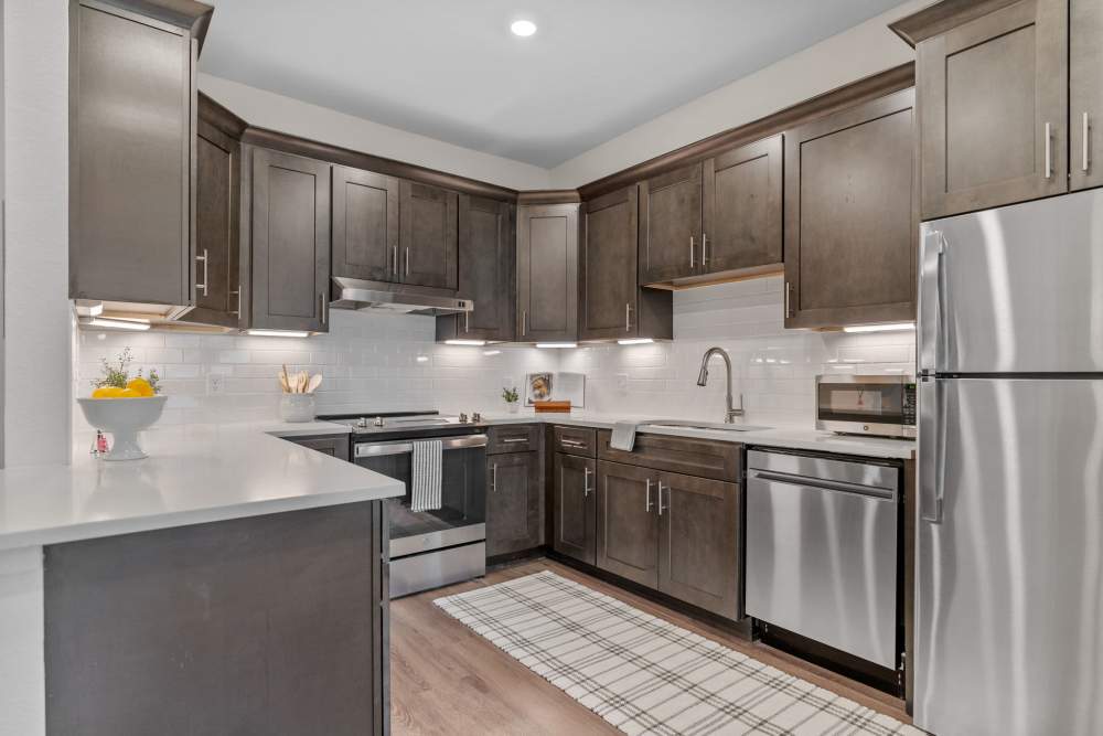 Kitchen with modern appliances at Amira Choice Arvada in Arvada, Colorado