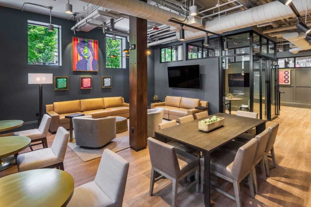 Seating around a TV in the clubhouse at Atrio Boston in Boston, Massachusetts