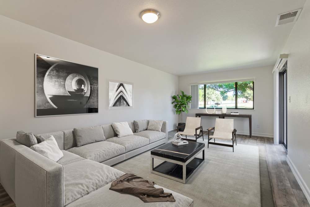 A townhome living room that leads to a kitchen at Miramar Townhomes in San Diego, California