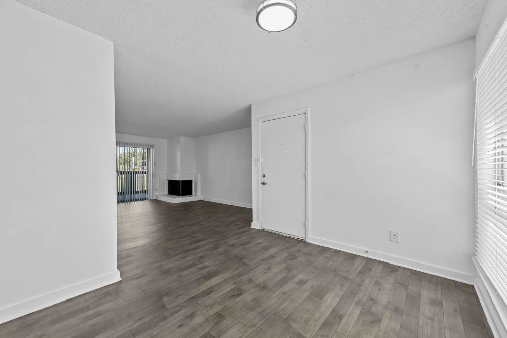 Bright living room with wood flooring at Stone Canyon in Arlington 