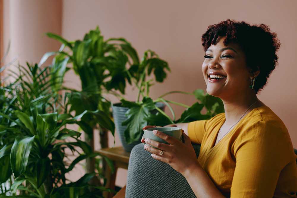 Resident drinking coffee at Columbine Apartments in Littleton, Colorado