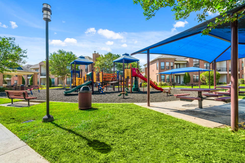  A colorful playground with slides and climbing structures at San Cierra in Houston, Texas