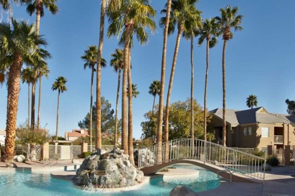 Swimming pool with water features at Calypso Apartments in Las Vegas, Nevada