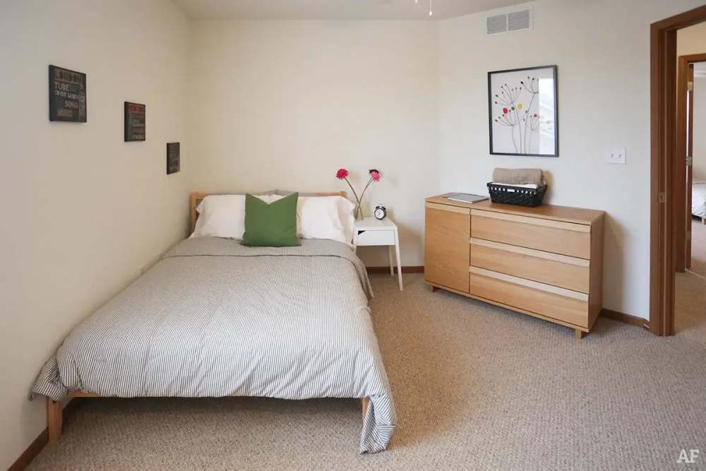 Vibrant bedroom with side table near Cross Creek Villas in Columbia, Missouri