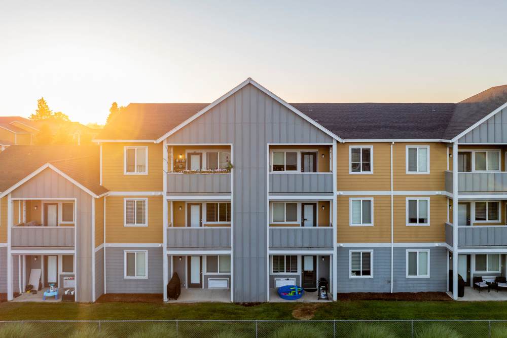 Sun setting behind buildings at Rock Creek Commons in Vancouver, Washington