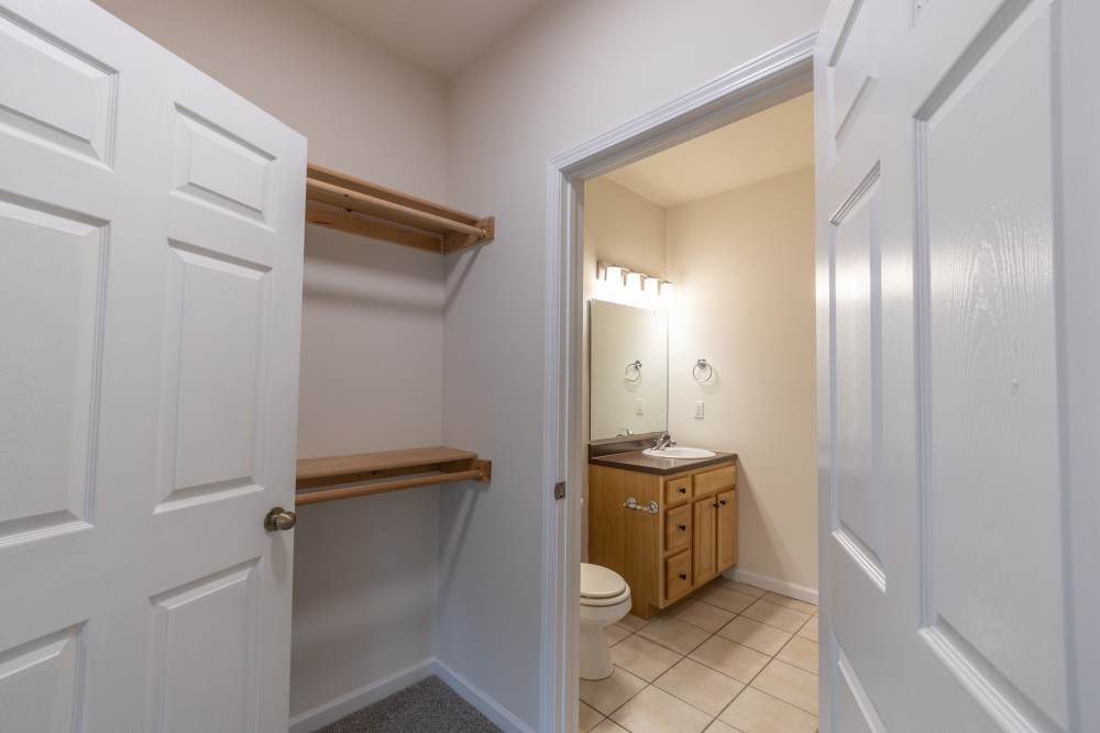 Walk-in closet connected to bathroom at Forest Ridge in Bloomington, Indiana, 