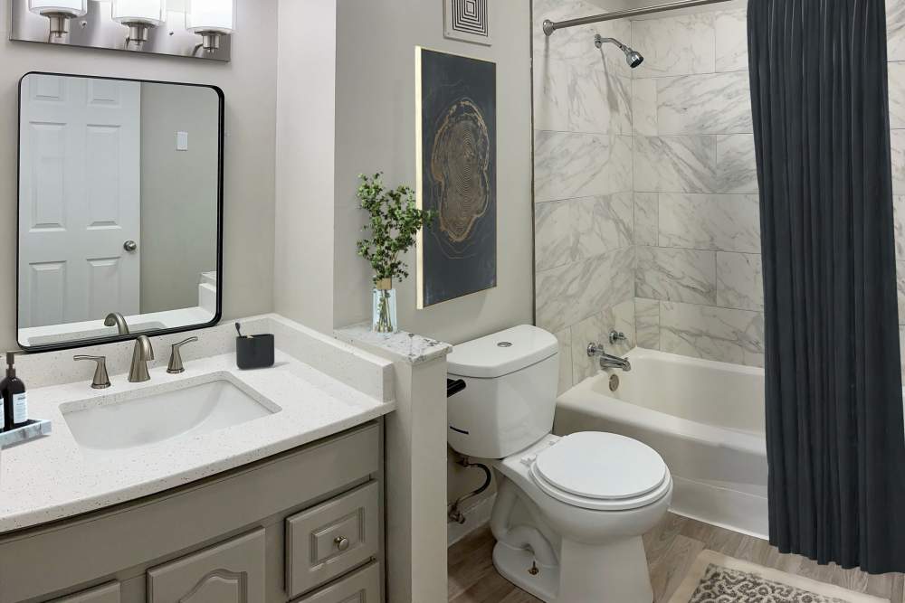 Bathroom with shower curtain at Belmont Place Apartments in Nashville, Tennessee